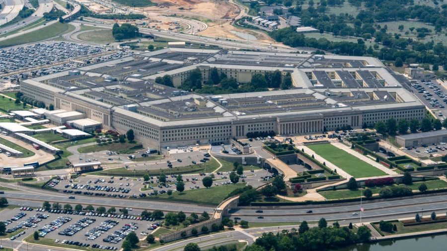The Pentagon complex and its central courtyard are seen from above, surrounded by roads, parking lots, and construction.